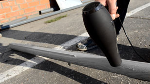 Shrink sleeves with a construction or a household hairdryer