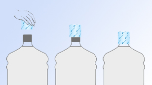 The heat-shrink band is being positioned on the product